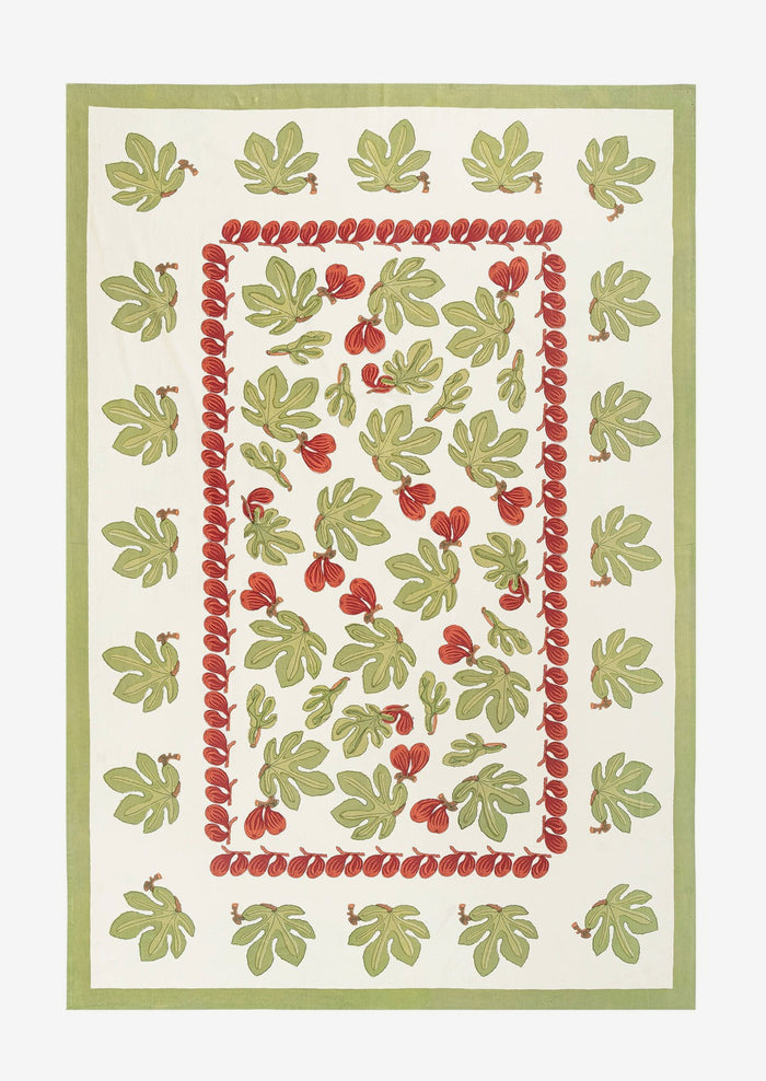 A block printed tablecloth with fig fruit and leaf pattern.