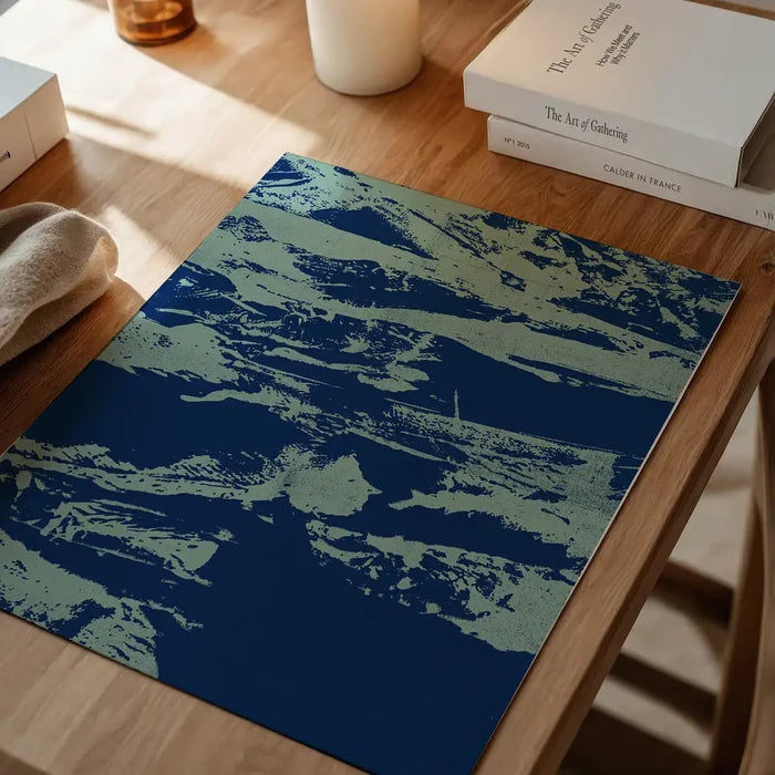 Inky blue graffiti print on thick art paper, featuring urban style art in blue tones on a wooden surface.
