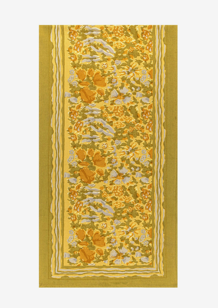 A mustard floral print table runner.
