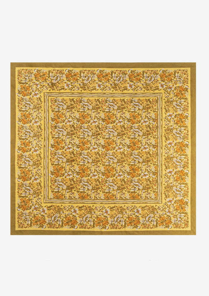 A mustard floral print tablecloth.