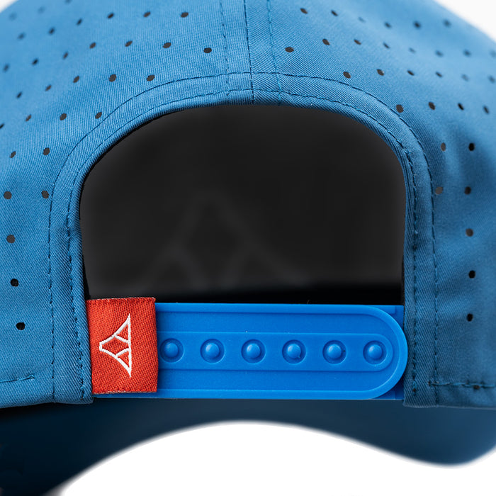 Blue cap with a red and white logo on the back, on a white background