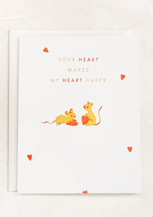 A card with image of two mice with hearts, text reads "Your heart makes my heart happy".