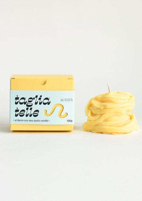 A candle in the shape of a piece of tagliatelle pasta.
